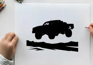 Silhouette of a monster truck in air with large wheels