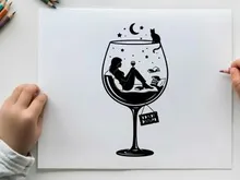 Silhouette of woman relaxing in wine glass under starry night