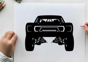 Silhouette of a rugged off road truck with large tires and suspension