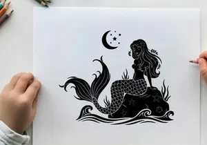 Mermaid silhouette sitting on rock under crescent moon