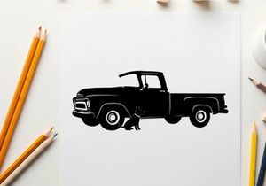 Silhouette of a classic pickup truck with a dog