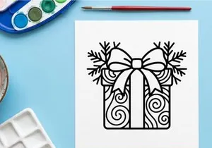 Elegant Christmas gift box with ornate bow and festive swirl patterns for holiday celebrations