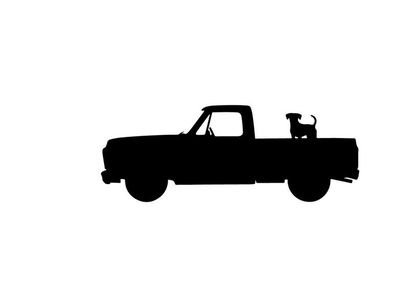 Silhouette of a pickup truck with dog in the back