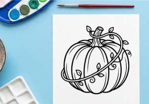 Decorative pumpkin with vines for autumn decor. Elegant fall centerpiece for seasonal celebrations.