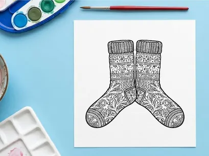Pair of cozy knitted Christmas socks with snowflake patterns for festive holiday gifting