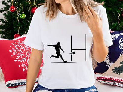 Soccer player kicking a ball towards the goal post in a match