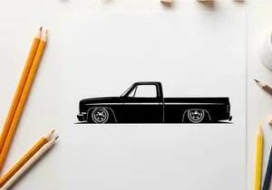 Silhouette of a classic lowered pickup truck with large wheels