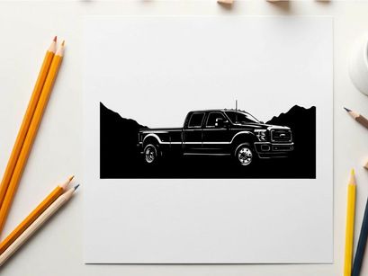 Silhouette of a pickup truck against a mountain range silhouette