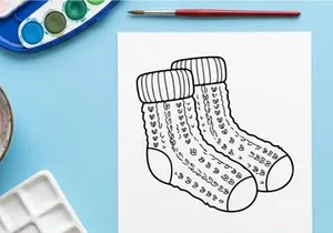 Pair of festive Christmas socks with holiday patterns and measurement scales for custom gifts