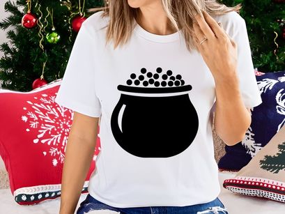 Black cauldron with bubbling dark liquid potion top view