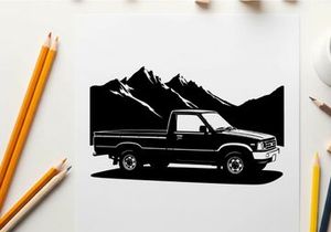 Silhouette of a pickup truck in front of mountains