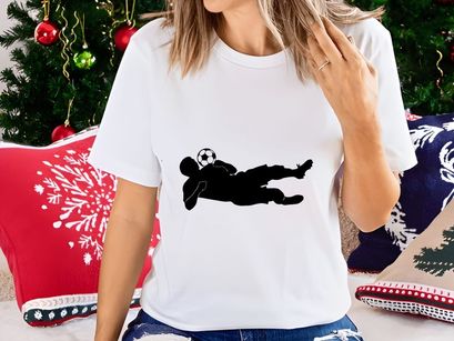 Soccer goalkeeper diving to save a ball in a match