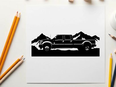Black silhouette pickup truck in front of mountain range silhouette