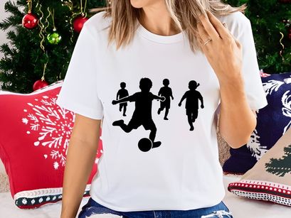 Children playing soccer silhouette
