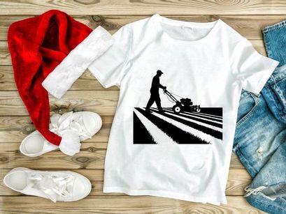 Man silhouette mowing lawn on sunny day with mower