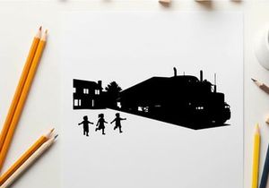 Silhouette of children playing near a train and buildings