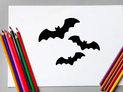 Silhouettes of Flying Bats in Night Sky for Halloween or Horror Themes