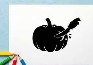 Silhouette of a pumpkin with a carved face and a knife inside