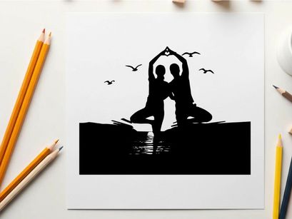 Silhouette of two people doing yoga on the beach at sunset