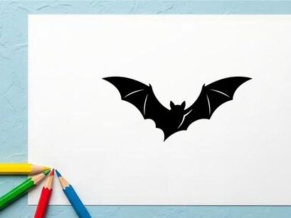 Silhouette of a Bat Flying with Spread Wings in Dark Night Scene
