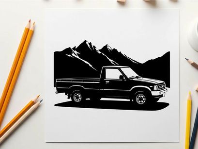 Silhouette of a pickup truck in front of mountains