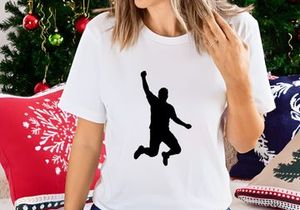 A silhouette of a person jumping in the air with one arm raised