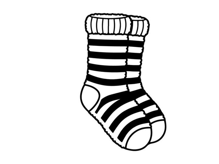 Cute striped Christmas sock with toe hole isolated on white background for festive holiday decor