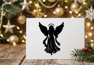 Black silhouette of a Christmas angel with wings and halo on a white background