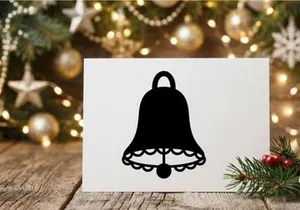 Black silhouette of a Christmas bell icon isolated on a white background