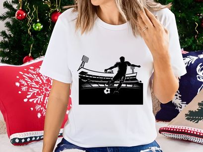 Soccer player kicking a ball in a stadium