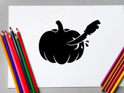 Silhouette of a pumpkin with a carved face and a knife inside