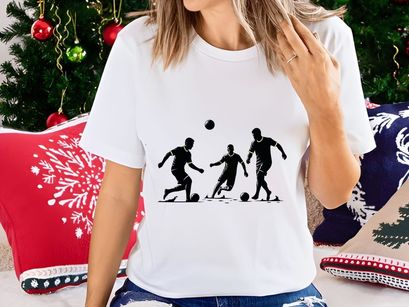 Silhouette of three soccer players in action kicking balls