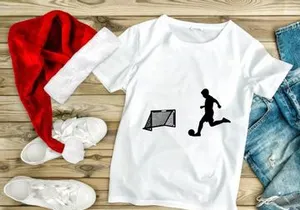 Silhouette of soccer player kicking ball towards goal