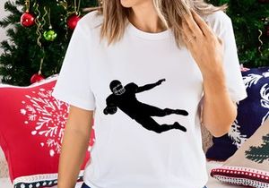 American football player diving with ball