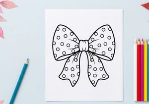 Polka dot gift bow illustration, black and white decorative ribbon for Christmas design.
