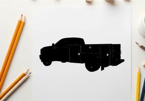 Silhouette of a large black truck with storage compartments