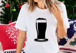 Dark beer in a pint glass with foam