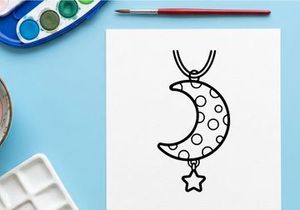 Colgante de luna creciente y estrella en cordón negro. Joyería celeste minimalista con patrón de puntos para moda y accesorios.