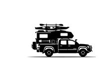 Silhouette of a truck with kayak and tent on top for outdoor adventure
