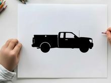 Silhouette of a pickup truck against a white background