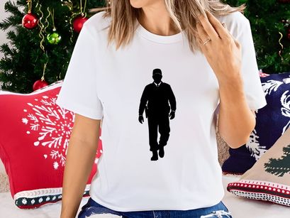 A black silhouette of a police officer walking towards the viewer on a white background