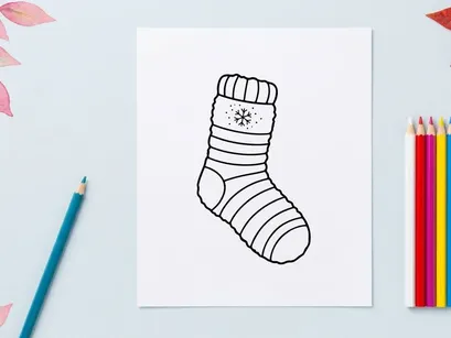 Cozy Christmas sock with snowflake pattern isolated on white background for festive holiday decor