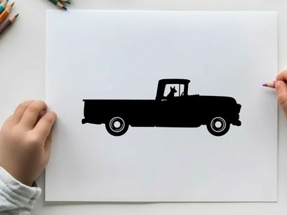 Silhouette of a classic pickup truck with a dog
