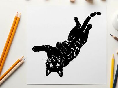 Silhouette of a playful cat in mid air falling or jumping