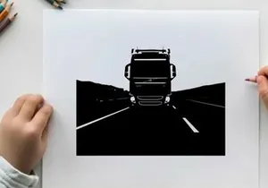 Silhouette of a large truck driving on a highway