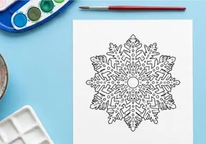 Intricate black and white snowflake illustration for Christmas holiday design projects