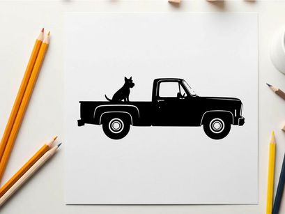 Silhouette of a dog sitting in the back of a pickup truck