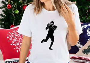 American football player catching ball in action silhouette