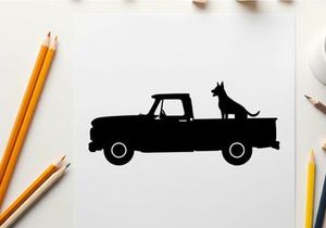 Silhouette of a dog sitting in the back of a pickup truck
