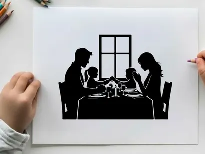 Family dinner in silhouette by the window